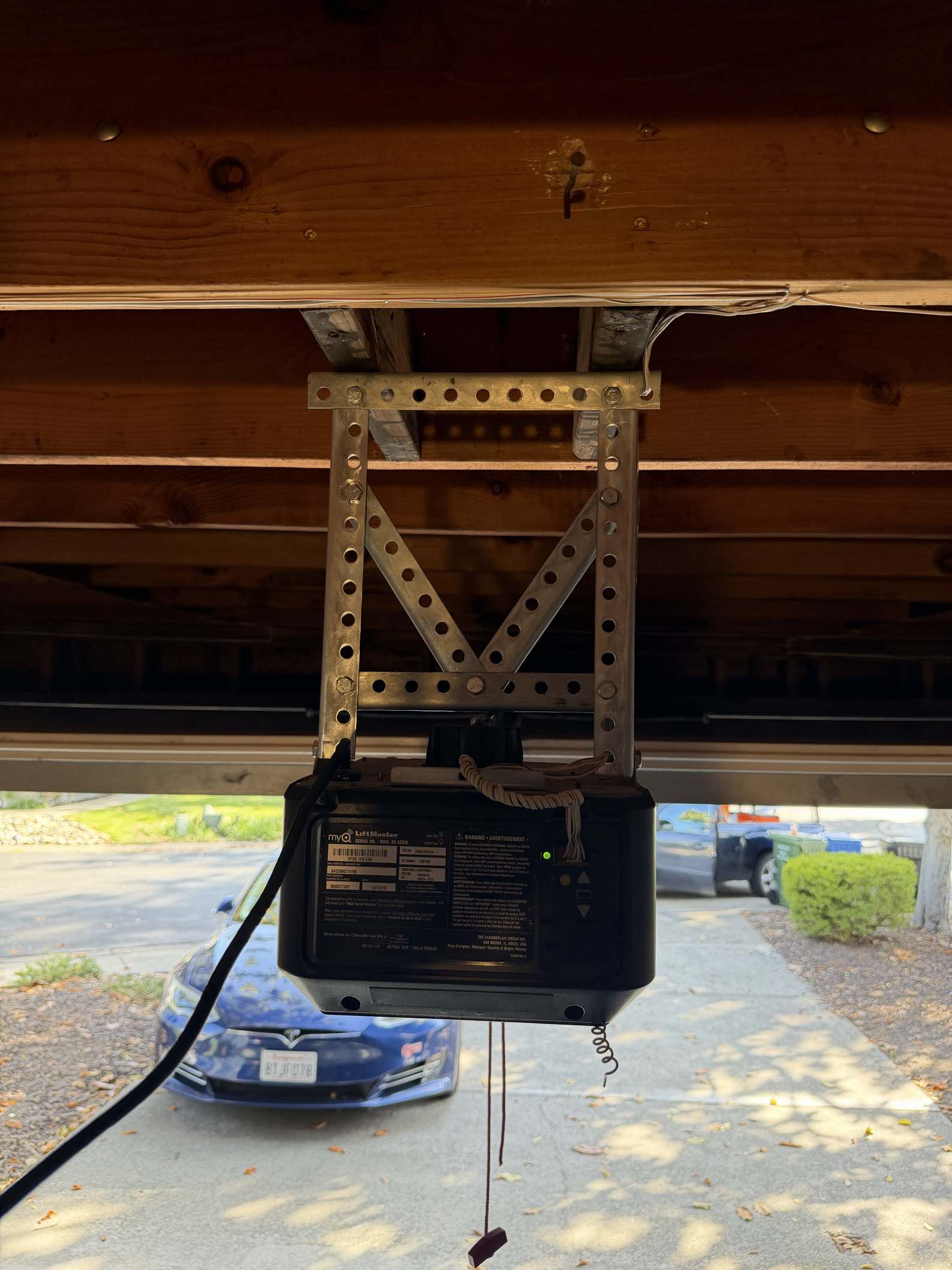 LiftMaster garage door opener installed on a garage ceiling